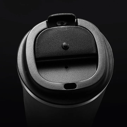 Black coffee cup lid on a black background