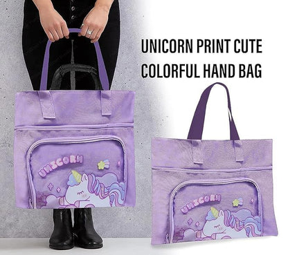 Purple tote bag with unicorn print held by a person against a gray background